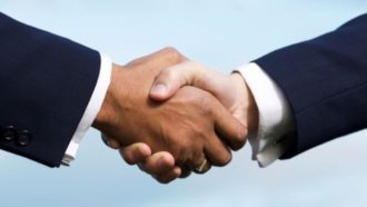 Image of two men shaking hands