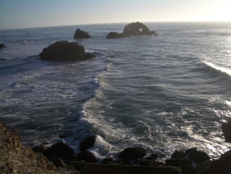 Image of waves crashing against the shore